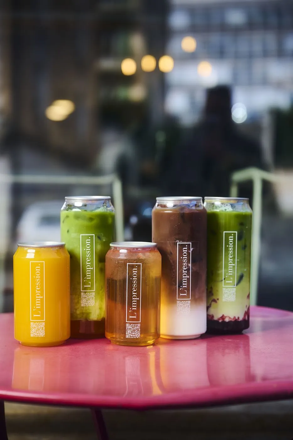 The iced drinks range lined up on a terrace table at dusk