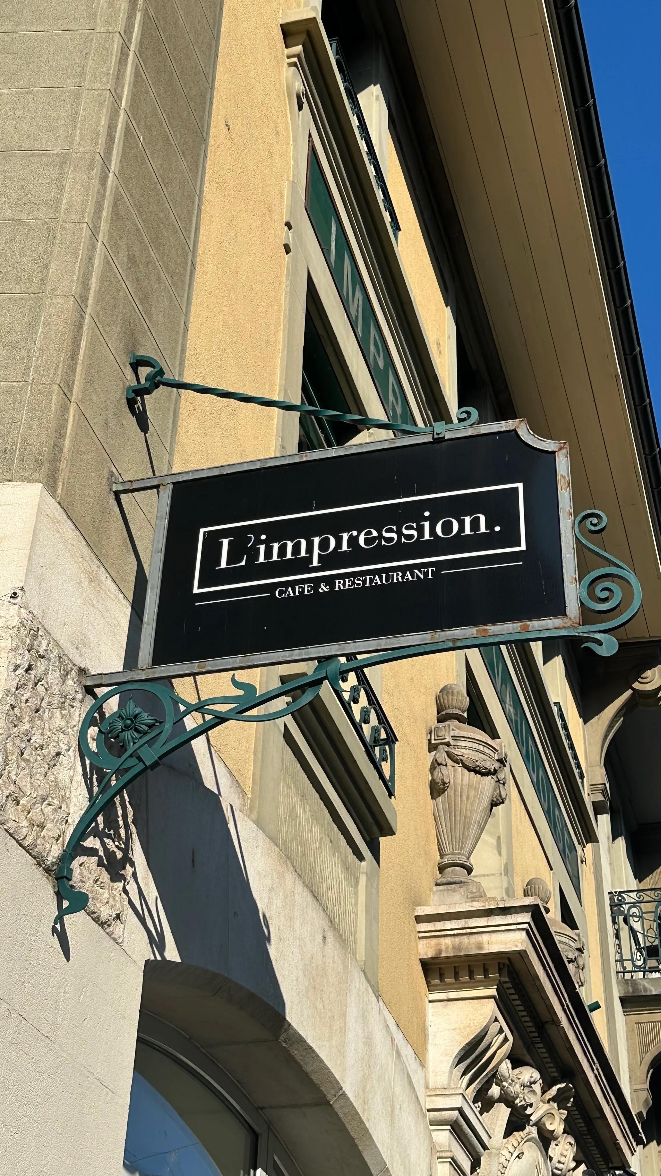 Facade of L'Impression Café with its sign, Avenue Louis-Ruchonnet, Lausanne