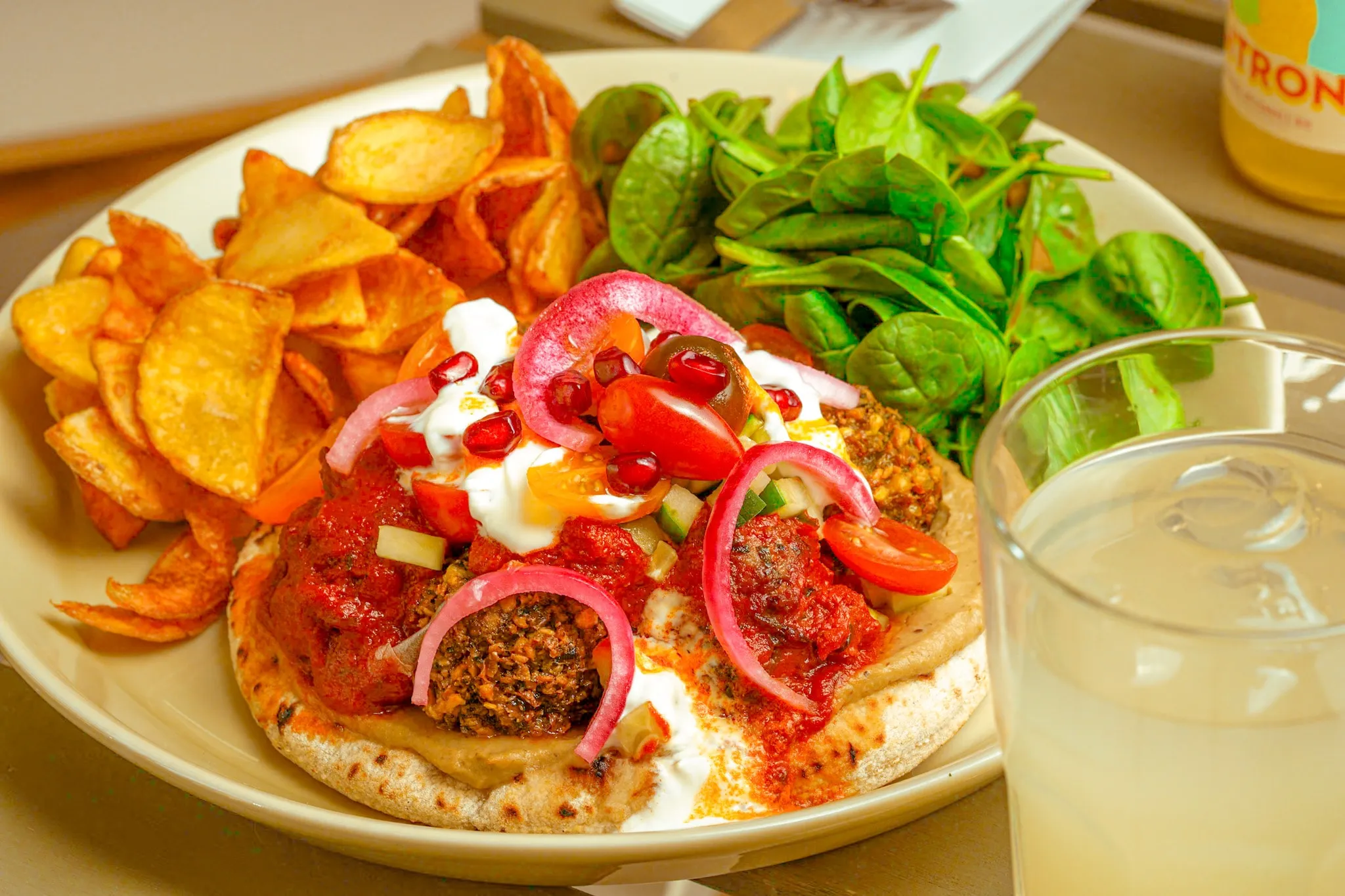 Naan, hummus and kefta, the menu’s travel-inspired side.